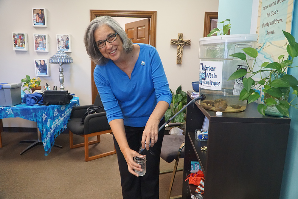 Ursuline Sr. Larraine Lauter demonstrates the use of a Sawyer PointOne filter Sept. 5, 2019, in Water With Blessings' office in Middletown, Kentucky. (CNS/The Record/Ruby Thomas)
