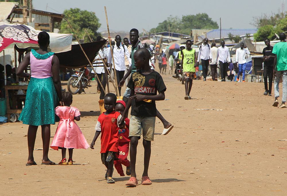 Internally displaced civilians are seen walking Jan. 23 at a Protection of Civilians site in the United Nations Mission in South Sudan compound outside Juba ahead of Pope Francis' Feb. 3-5 visit to South Sudan. (OSV News/Reuters/Samir Bol)