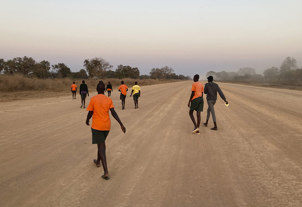 Students and interns from Loreto Secondary School participate in a training walk Jan. 14 in Rumbek, South Sudan, as they prepare to join others from the Diocese of Rumbek on a nine-day pilgrimage, walking to Juba for the Feb. 3-5 visit of Pope Francis. (CNS/Courtesy of Sr. Orla Treacy)