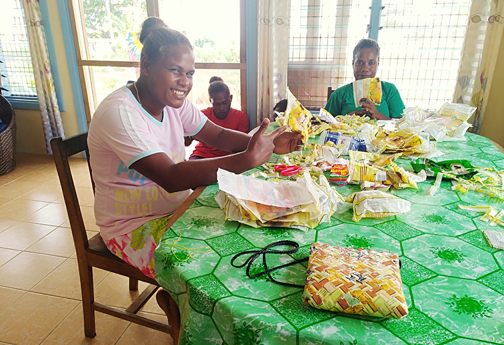 Students recycle plastic into handbags and coin purses in June 2021 at San Isidore Care Centre. (Courtesy of Maria Fe Rollo)