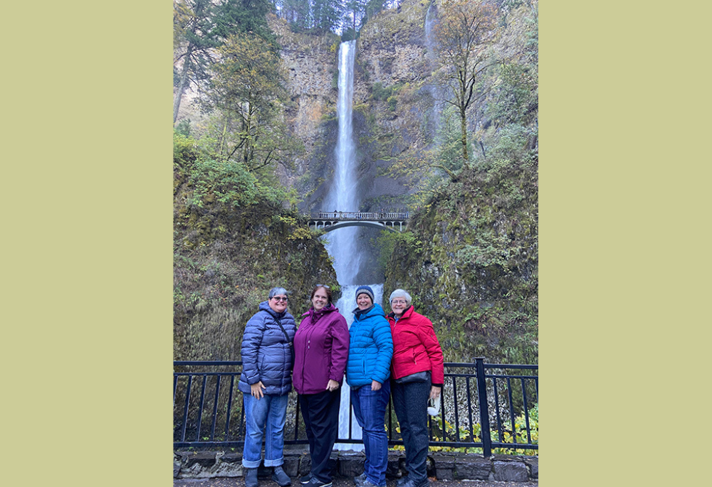 Jennifer Wilson and members of the vocation team for the Sisters of Mercy stand at the bottom of the falls before hiking to the top. (Courtesy of Jennifer Wilson)