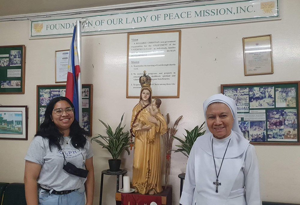 St. Paul de Chartres Sr. Eva Fidela Maamo, right, poses with Madeline Garcia, Maamo's assistant secretary, at the Foundation of Our Lady of Peace Mission in Paranaque City, Philippines. (Oliver Samson)