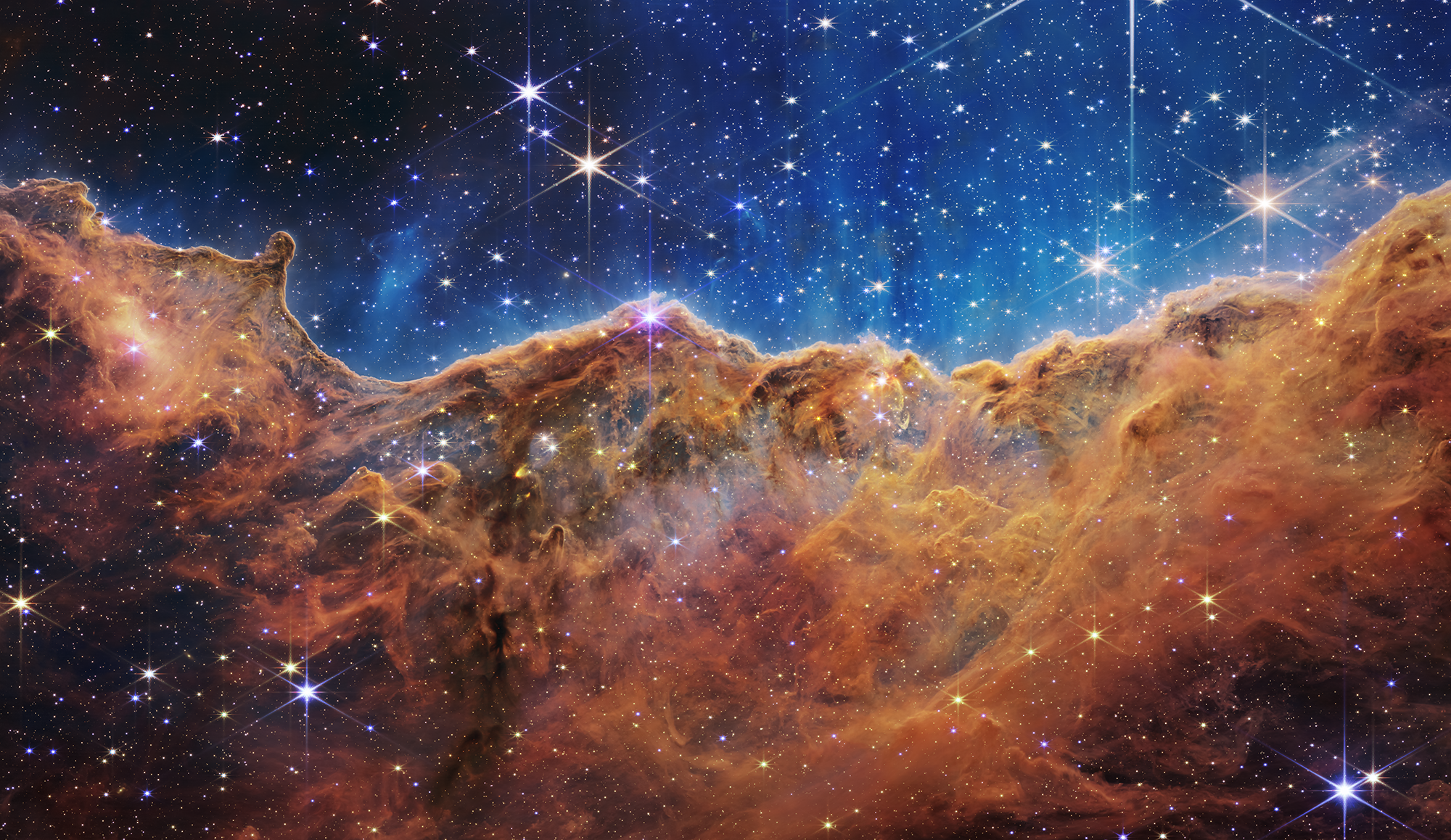 NASA's James Webb Space Telescope captured this image July 12, 2022, showing what NASA describes as "the edge of a nearby, young, star-forming region called NGC 3324 in the Carina Nebula." (Flickr/ NASA's James Webb Space Telescope, CC BY 2.0)