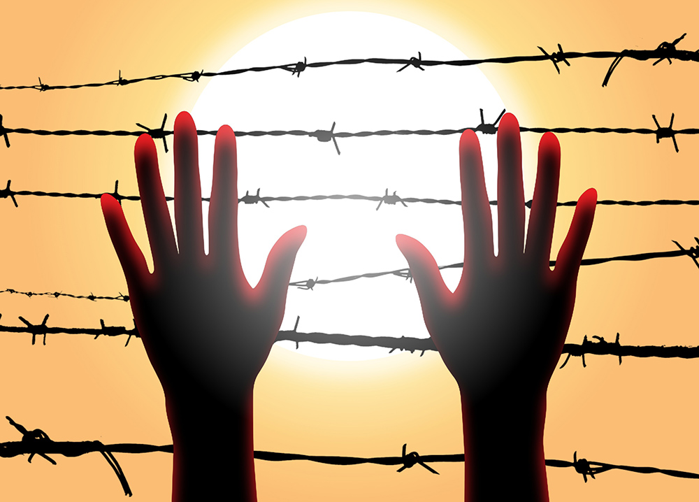 A women's hands reaching up to barbed wire (Pixabay/Zaid Pro)