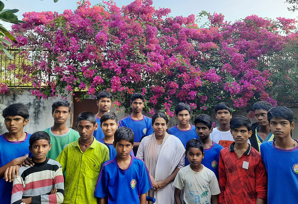 Pillai with children inside Navjeevan campus (GSR photo/Saji Thomas)