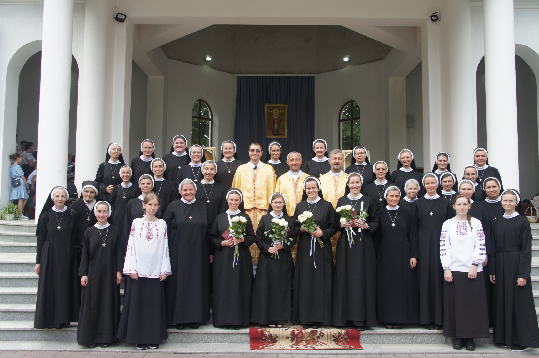 Basilian Sisters and others pose after four Basilian Sisters took their perpetual vows on July 24, 2022, in Ukraine. 