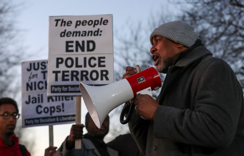 A man speaks through a bullhorn during a protest in Memphis, Tenn., Jan. 27, on the day of the release of the video showing police officers beating Tyre Nichols, the young Black man who was killed as a result of a traffic stop by Memphis police officers. (OSV Newso/Alyssa Pointer, Reuters)