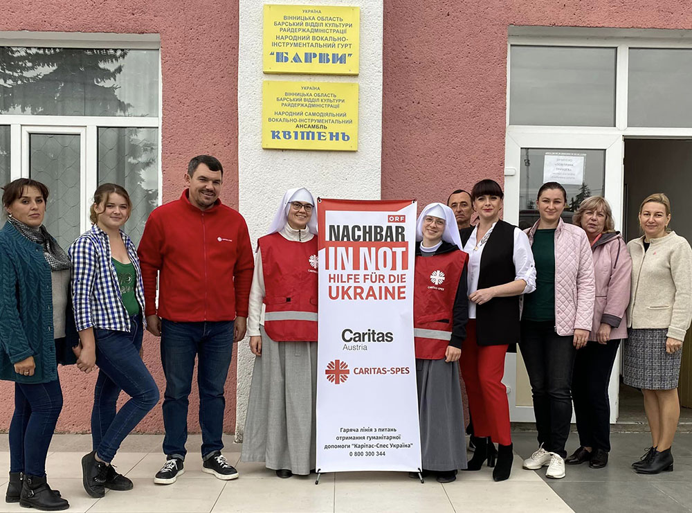 Sisters with volunteers from the Caritas charity foundation provide humanitarian aid to refugees in Ukraine. (Courtesy of Scholastica Oleksandra Hulivata)
