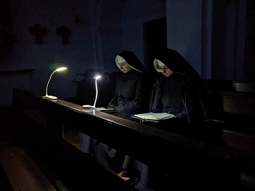 Sisters pray in the chapel of a Benedictine monastery in Ukraine when the lights are turned off. (Courtesy of Scholastica Oleksandra Hulivata)