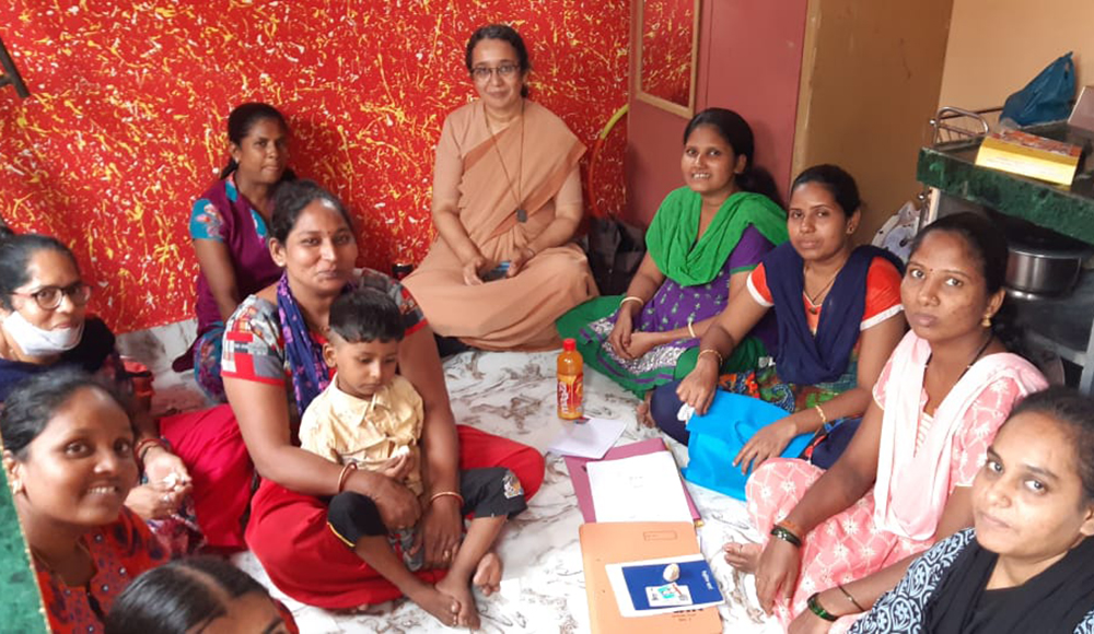 Canossian Sr. Catherine Gonsalves, center, a former pupil of Nirmala Niketan, with beneficiaries at a self-help group meeting in Mahim, a suburb of Mumbai, India (Courtesy of Catherine Gonsalves)