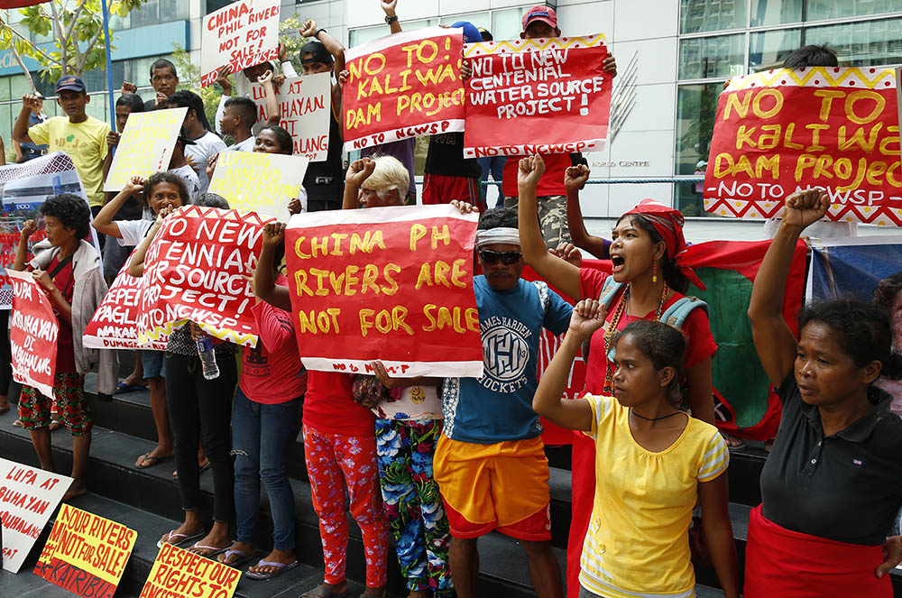 Protesters, mostly Indigenous peoples, rally outside the Chinese Consulate in suburban Makati in metro Manila on Oct. 5, 2018, to oppose Chinese funding of the Kaliwa Dam and other infrastructure projects in the Philippines. (AP/Bullit Marquez)
