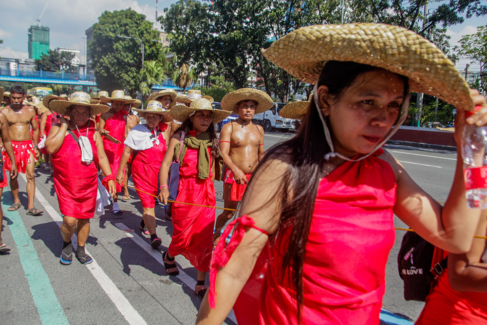 About 300 Indigenous people march Feb. 23 in Quezon City, Philippines, during a nine-day march to protest the construction of the Kaliwa Dam in their ancestral domain in the Sierra Madre mountain range. (Newscom/Sipa USA/Pacific Press/Edd Castro) 