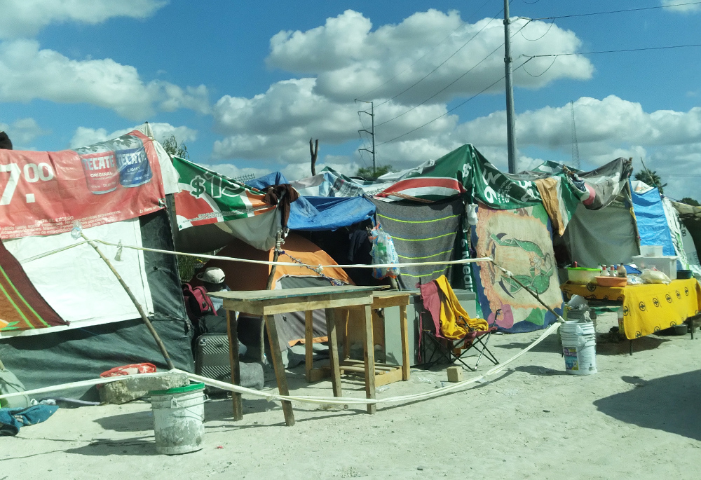 A tent city in Reynosa, Mexico, where thousands of people are waiting to cross the border into the United States to apply for asylum. Hundreds of sisters volunteered there, leading to a handful moving there permanently. (Courtesy of Immaculate Heart of Mary Sr. Rose Kuhn)