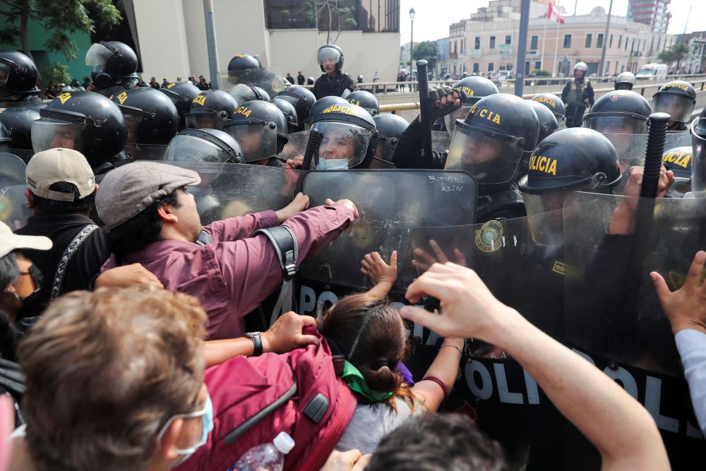 Anti-government protesters clash with police in Lima, Peru, on Jan. 21 as they demand the release of protesters detained in demonstrations supporting ousted former President Pedro Castillo.