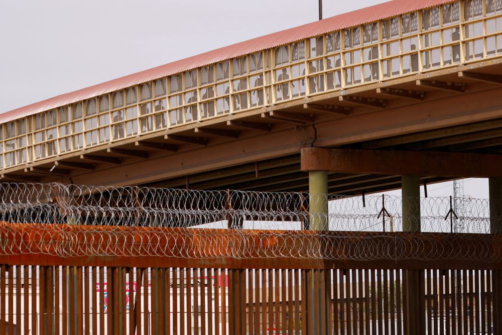 3.	Venezuelan migrants expelled from the U.S. under Title 42 walk across the Lerdo-Stanton International border bridge to Ciudad Juarez, Mexico, Oct. 14, 2022. (CNS/Reuters/Jose Luis Gonzalez)