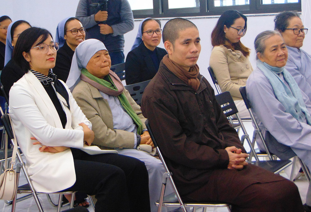 Dr. Thich Tam Quang (center), head of Hai Duc Clinic in Hue, Vietnam, and other Buddhists attend the Kim Long Charity Clinic's 30th anniversary celebration Dec. 17, 2022, in Hue, Vietnam. (Joachim Pham)