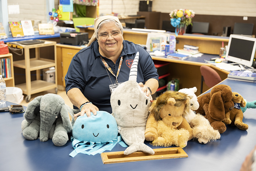 Teresian Sr. Mary Lou Aldape shows off her stuffed animals in the library at Sacred Heart Catholic School in Uvalde, Texas, in August 2022. (OSV News/Courtesy of Catholic Extension/Juan Guajardo)