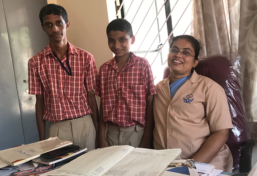 Sr. Ancilla Fernandes, a member of the Missionary Sisters Servants of the Holy Spirit, poses with Lohith Sreedhar, center, and Yatheesh Kumar, left, students of the Manasa Rehabilitation and Training Centre in Pamboor. (Thomas Scaria)