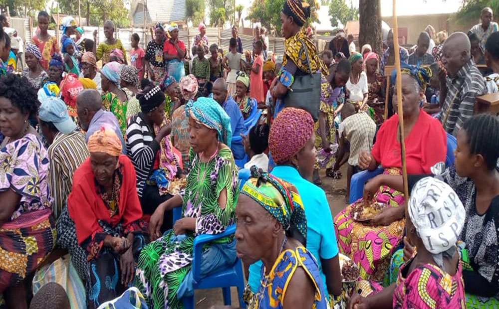 Congolese women gather in the churchyard in the town of Kiwanja, Rutshuru, Democratic Republic of Congo. (Stephano Kambale)