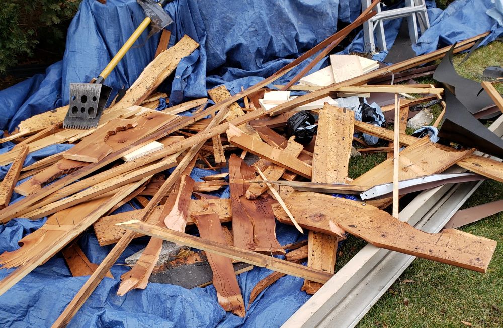 A pile of pieces of wood from a roof repair