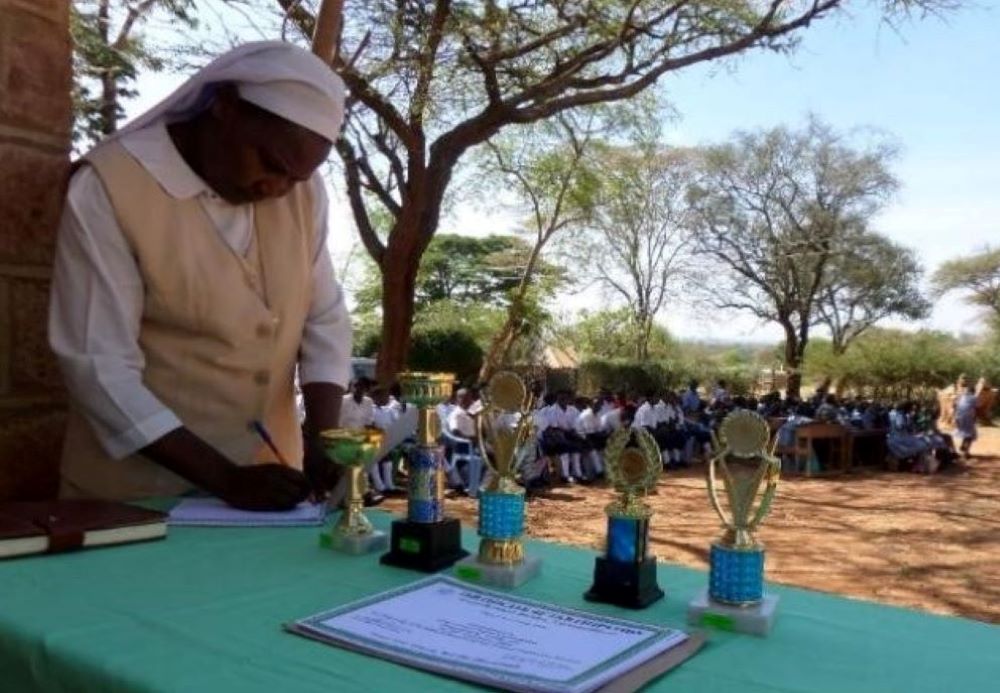 Sr. Josephine Kwenga prepares certificates and trophies to students during an annual commemoration of World Environmental Day in the Machakos Diocese, Kenya. (Courtesy of AOSK)