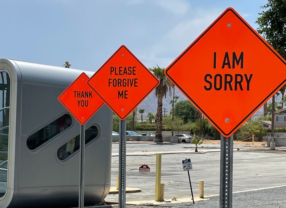 3 orange traffic signs: "I am sorry", "Please Forgive me" and "Thank you".