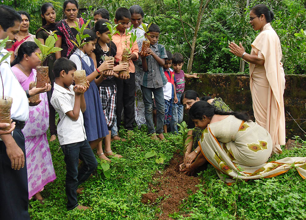 Sr. Felicita Pinto of the Helpers of Mount Rosary coordinates a seed-planting and sapling-distribution ceremony during the World Environment Day celebrations on June 5, 2022, at the congregation's headquarters in Alangar near Moodabidri, a town in the southwestern Indian state of Karnataka. (Courtesy of Celestine D'Souza)
