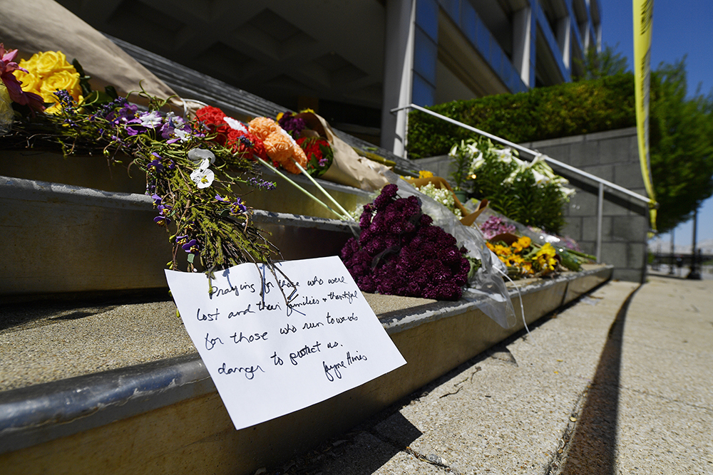 Flowers and a message of hope sit on the steps of the Old National Bank in Louisville, Kentucky, on April 11.