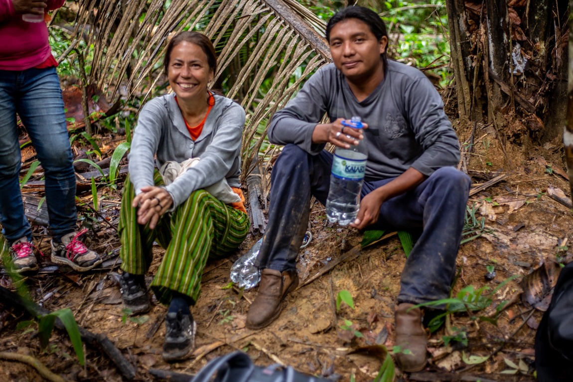 Sr. Laura Vicuña sits next to a member of the Karipuna people