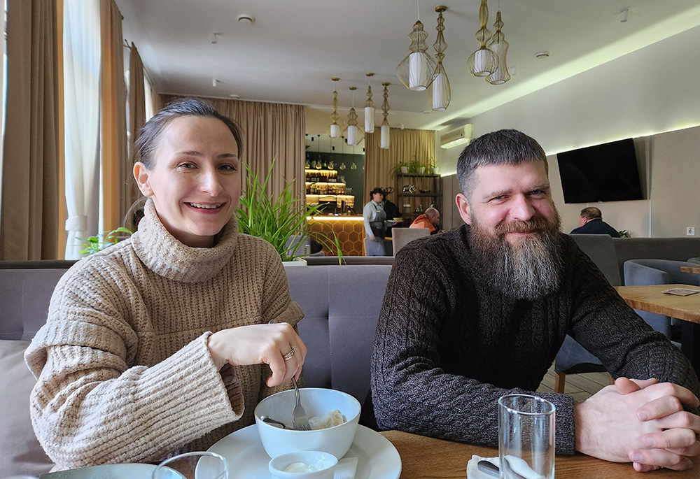 Translator Iryna Chernikova, 33, and her husband, Stas Nepokrytyi, 42, driver, in a restaurant in Bucha, a city just west of Kyiv and famous now for atrocities committed by Russian forces early in the war: "Who knew Bucha would ever be famous?" Iryna said. (GSR photo/Chris Herlinger)