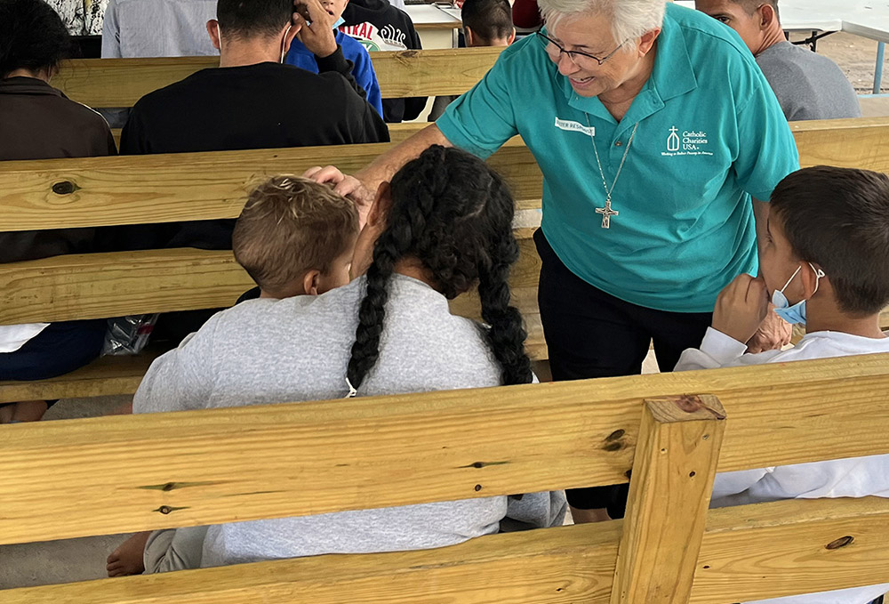 Notre Dame Sr. Joyce Bates welcomes new guests at La Frontera in Laredo, Texas, in the days following the expiration of Title 42. (Luis Donaldo Gonzalez)
