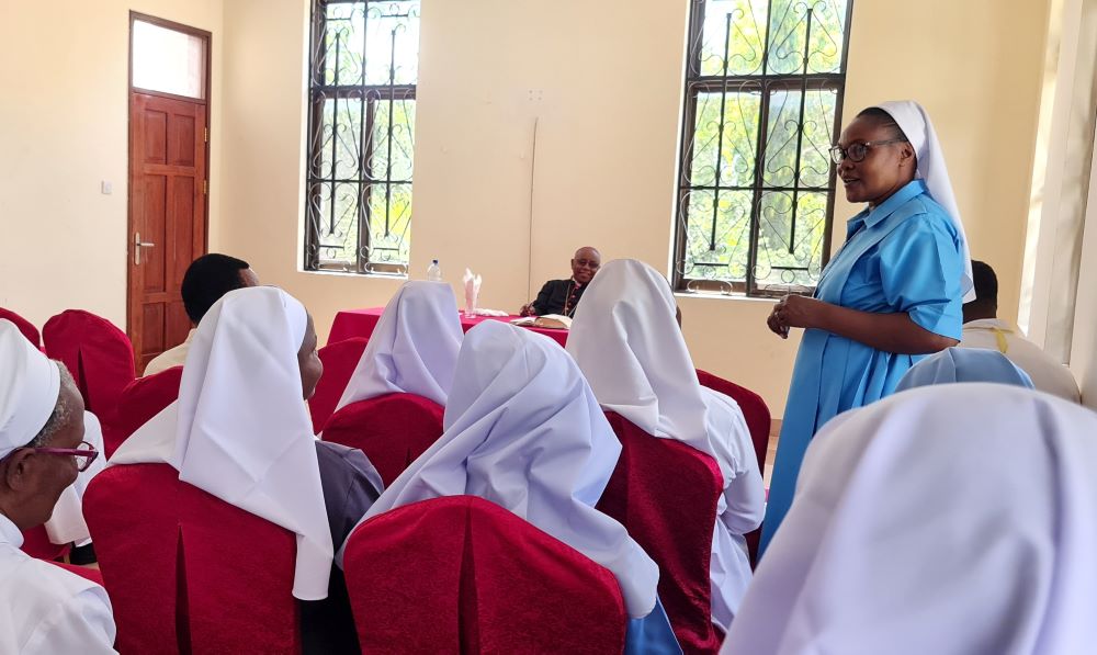 Sister Anne Lucy, chair of the religious in Zanzibar, speaks at the celebration of religious as Bishop Augustine Shao listens. (Courtesy of Christine Masivo)
