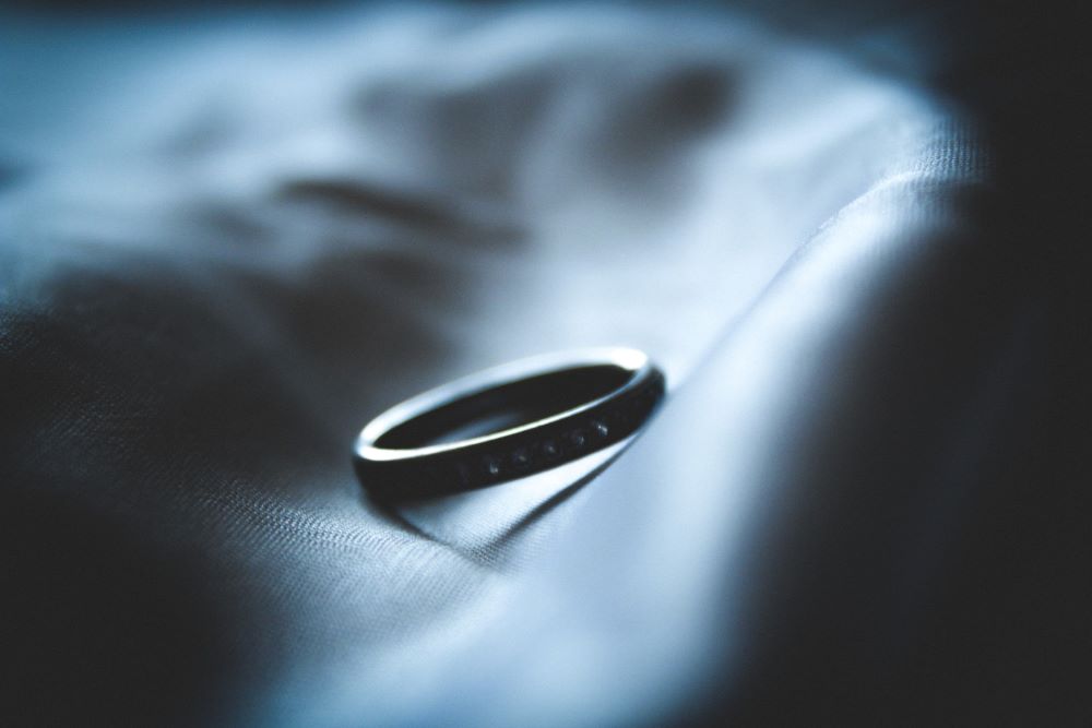 closeup of a hand holding a ring 