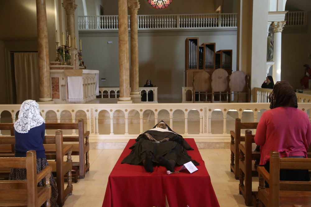 The exhumed body of Sr. Mary Wilhelmina Lancaster, foundress of the Benedictines of Mary, Queen of Apostles, lies in repose in the church at the Abbey of Our Lady of Ephesus in Gower, Mo., May 21. (OSV News photo/Megan Marley)