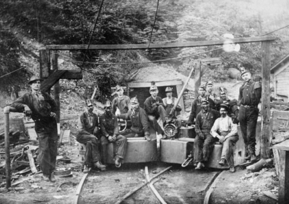 Coal miners are pictured at the entrance to the Richard Mine, owned by the Elkins Coal and Coke Company in Deckers Creek, West Virginia, in this 1976 photograph. (Library of Congress/Historic American Engineering Record)