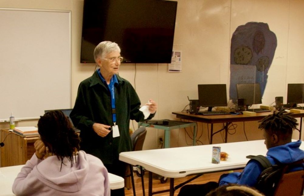 Sr. Kathleen Navarra speaks to students in an after-school program at the Edmundite Missions on March 15 in Selma, Alabama. The missions offer numerous educational programs; only 13% of Selma public high school students tested at or above state proficiency reading levels. (GSR photo/Dan Stockman)