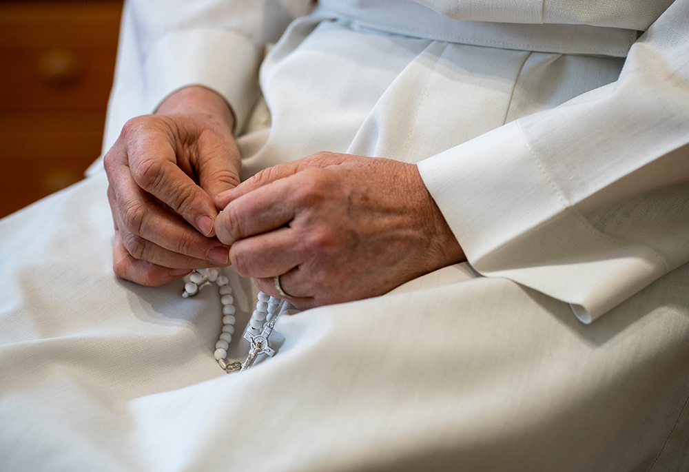 Sr. Lydia Timkova, 56, a Slovakian sister and member of the Dominican Sisters of Blessed Imelda, with her rosary during an interview in early February at the convent she shares with other sisters in Mukachevo, Ukraine. She fingered the beads in recalling the shock of the full-scale Russian invasion of Ukraine on Feb. 24, 2022. (Gregg Brekke)