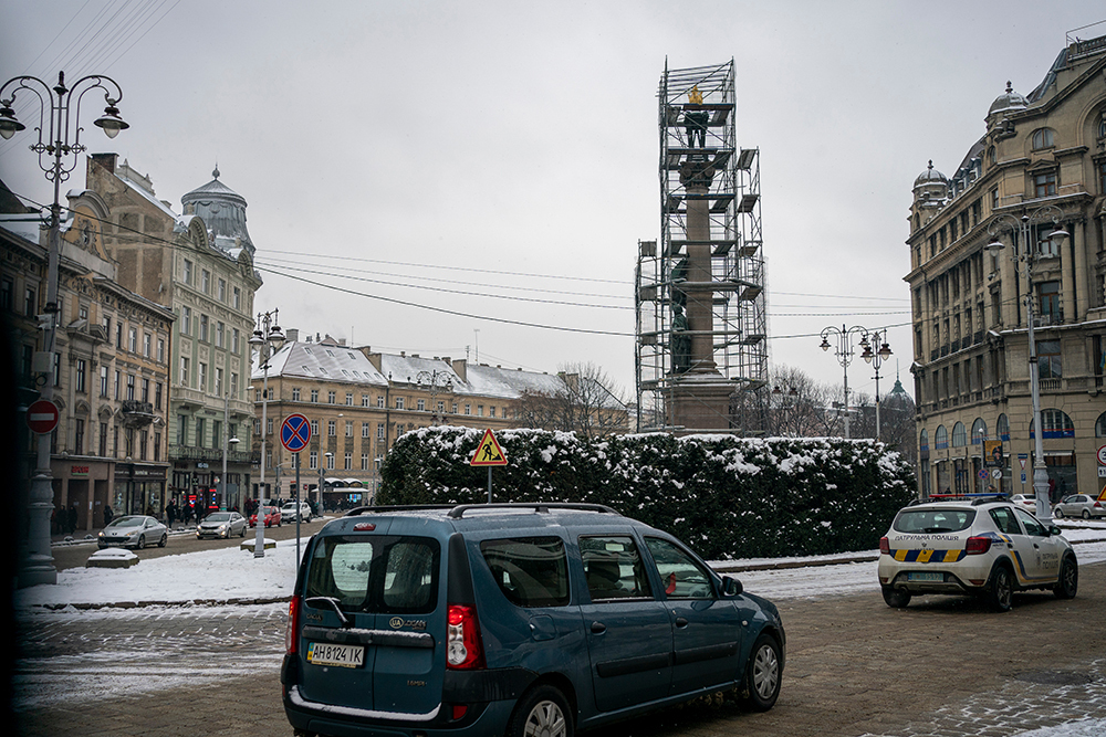 Scaffolding protects a monument in the center of Lviv, Ukraine.