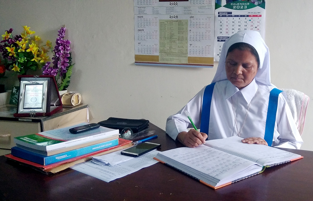 Sr. Mary Rina Magdeline Cruze works at her office in Kumudini Nursing College in March in Tangail, Bangladesh. (Sumon Corraya)
