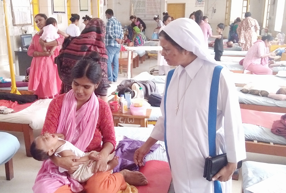 Sr. Mary Rina Magdeline Cruze looks after patients at Kumudini Hospital in Tangail, Bangladesh, in March. (Sumon Corraya)