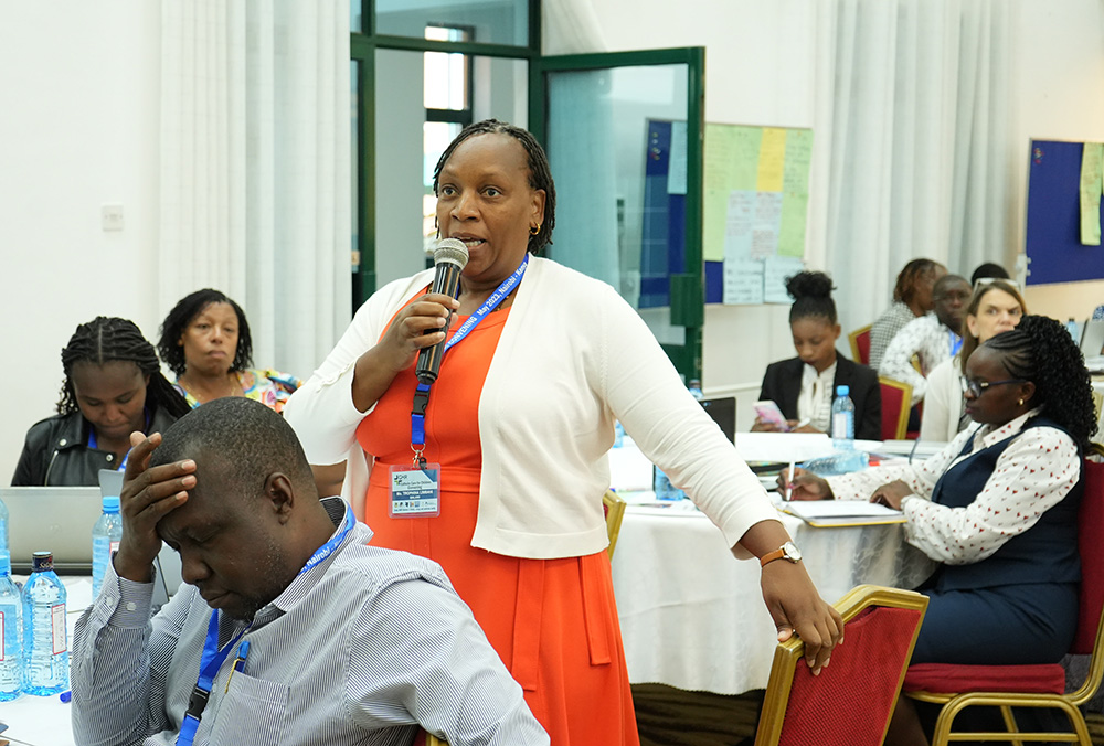 Trophina Limbani, a social welfare officer in Malawi, responds to questions from the audience on legal and national frameworks that govern child care institutions and children's reintegration policies in Malawi. Limbani was among government representatives who attended the Catholic Child Care convening in Nairobi, Kenya. (GSR photo/Wycliff Peter Oundo)