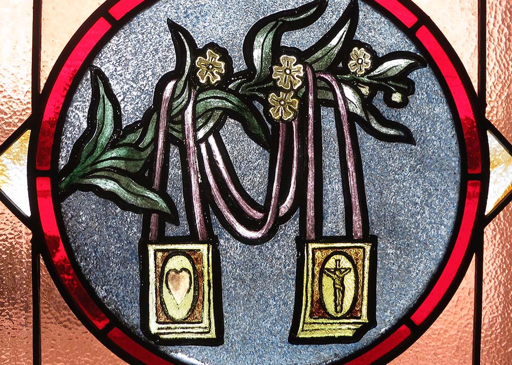 A scapular is depicted in stained glass at St. Brigid of Kildare Church in Dublin, Ohio. (Wikimedia Commons/Nheyob)