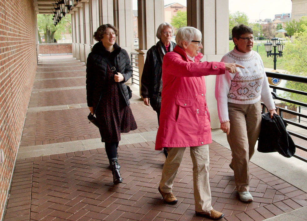Women Touched by Grace participants, from left, the Rev. Julie Webb, Benedictine Sr. Betty Drewes, Benedictine Sr. Mary Luke Jones and the Rev. Tamara Franks walk the grounds at the Indiana Historical Society in Indianapolis on April 28. (GSR photo/Dan Stockman)