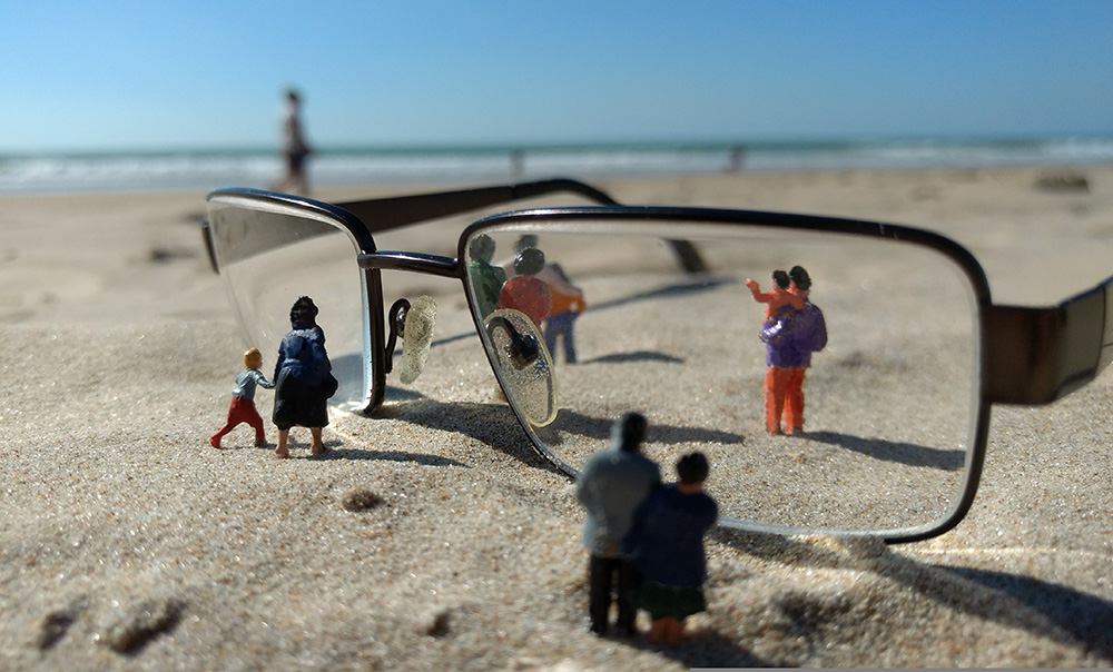 Eyeglasses looking at miniature people (Pixabay/Wilfried Pohnke)