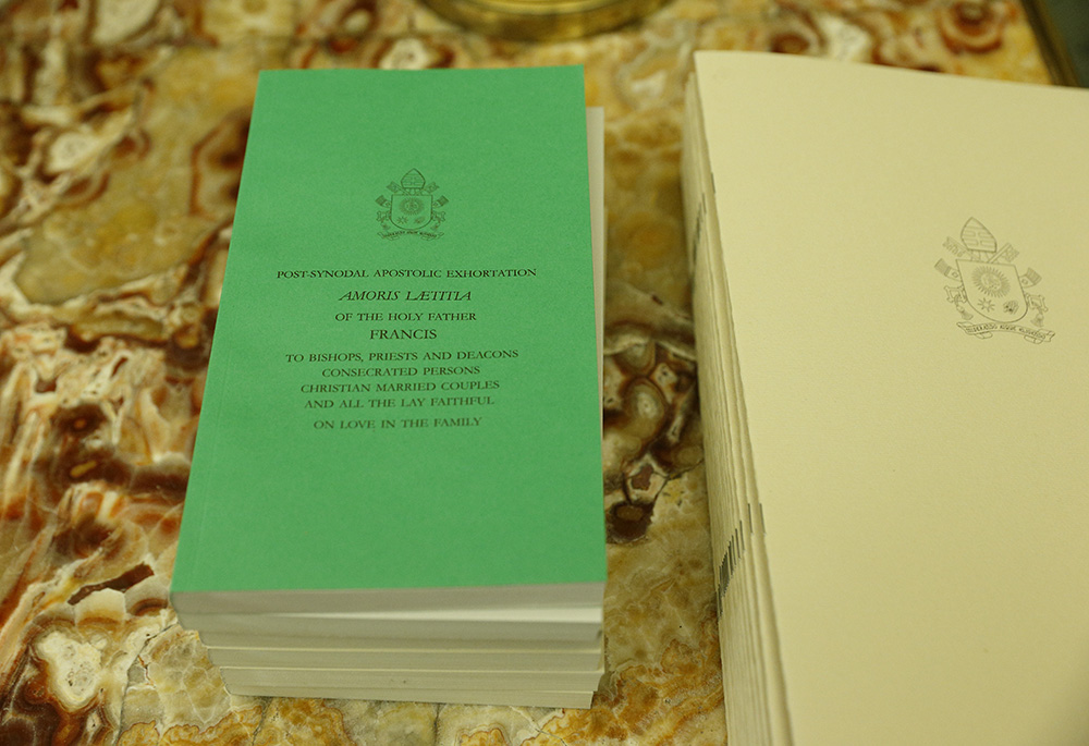 Copies of Pope Francis' apostolic exhortation on the family, Amoris Laetitia ("The Joy of Love"), are pictured Jan. 16, 2017, on a table at the Vatican. (CNS/Paul Haring)