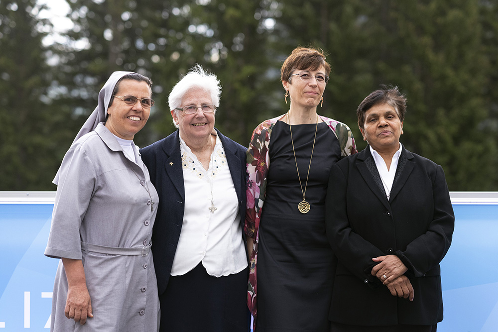 Leaders of the International Union of Superiors General and the Global Solidarity Fund are pictured at the World Economic Forum in Davos, Switzerland, May 23, 2022. From left are Salesian Sr. Ruth del Pilar Mora, a native of Colombia who was worked in Ethiopia for years; Loreto Sr. Patricia Murray, executive secretary of the women's International Union of Superiors General; Marta Guglielmetti, executive director of the Global Solidarity Fund; and Sr. Mary John Kudiyiruppil, a member of the Missionaries of t