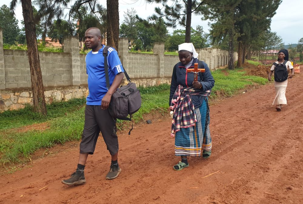 Sr. Mary Olive Masibo and Fr. Dennis Paddy Wandera make their way to the Uganda Martyrs Shrine Namugongo to honor the 22 Catholic Uganda martyrs who were murdered for refusing to denounce their faith. (GSR photo/Gerald Matembu)