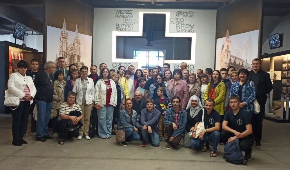 A group of students, teachers and employees of the Institute of Theological Sciences of the Immaculate Virgin Mary in Horodok, Ukraine stand in the Martyrs Memorial in the city of Tyvriv. (Courtesy of Iryna Saszko)