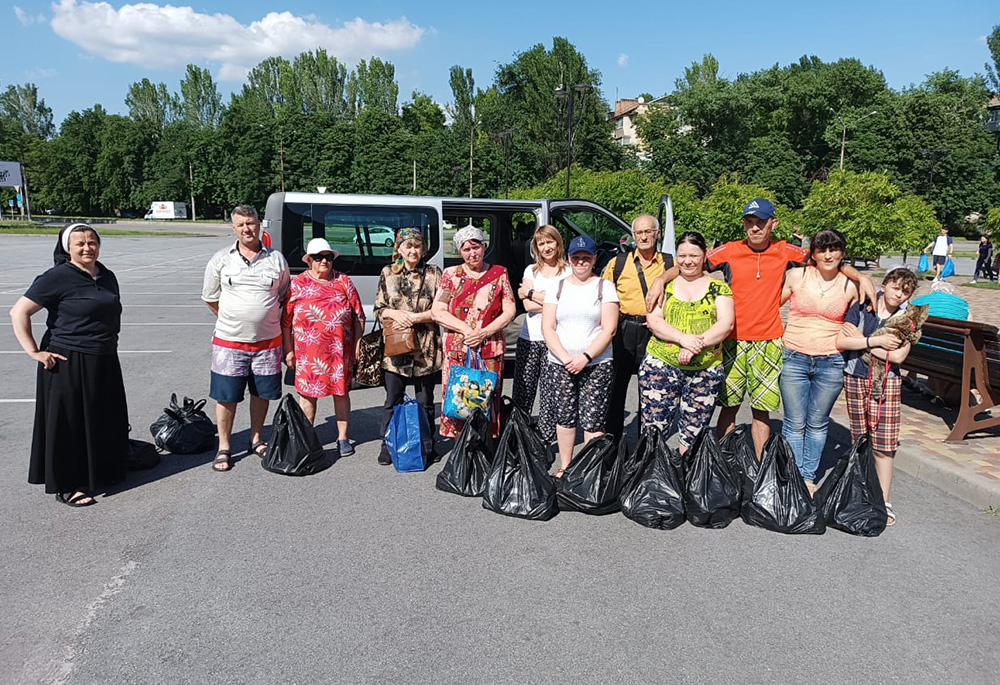 Sr. Lucia Murashko, a member of the Sisters of the Order of St. Basil the Great, with volunteers in the city of Zaporizhzhia, responding to the floods caused by the June 6 collapse of the Nova Kakhovka dam on Ukraine's Dnipro River. (Courtesy of Sr. Lucia Murashko)