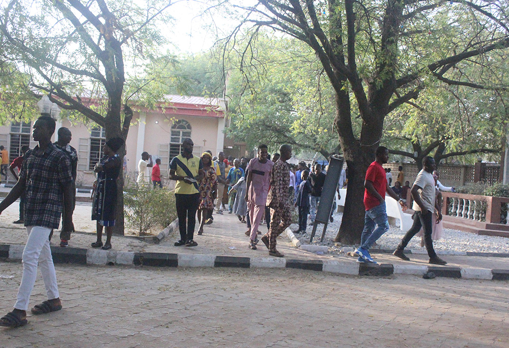 Parishioners exit the church after 6 a.m Mass on March 5. (Patrick Egwu)